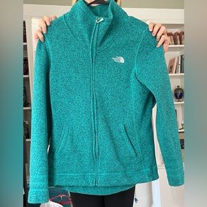 Green zip up north face jacket